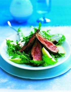 Lamb fillet with harissa, and rocket and pear salad