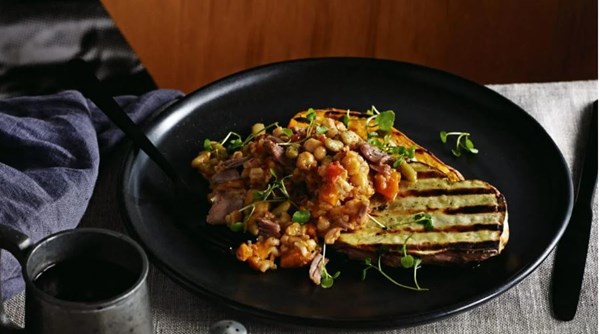Lamb, grain and bean stew with chargrilled kumara steaks