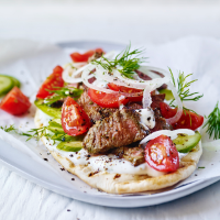Lamb gyros with tomato salad and garlic yogurt