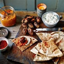 Lamb koftas with walnut and feta romesco sauce & lemony garlic yogurt sauce