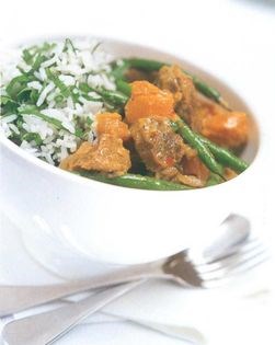 Lamb leg coconut curry with green beans and kumara on herbed rice