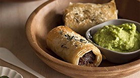 Lamb sausage rolls with minted pea purée [Kate Fay]