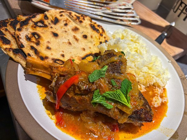 Lamb shanks rogan josh with ajwain pancakes