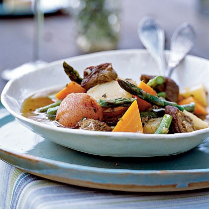 Lamb shoulder braised with spring vegetables, green herbs, and white wine