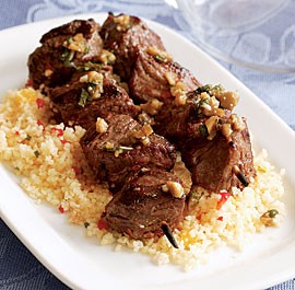 Lamb skewers with green olives & mint sauce