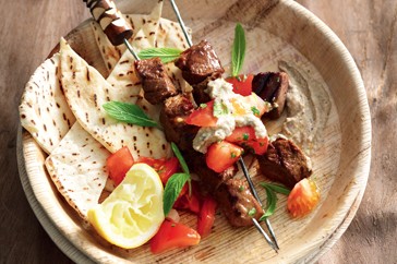 Lamb souvlaki with minted tomatoes