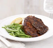 Lamb steak with crispy potatoes & minted beans