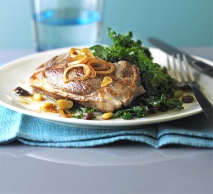 Lamb steaks with winter greens, raisins and pine nuts