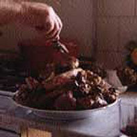 Lamb stewed with wine, herbs and anchovies