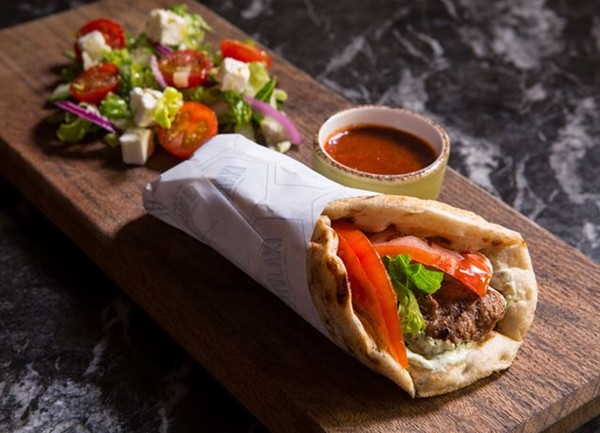 Lamb wrap with red pepper sauce and herb yoghurt