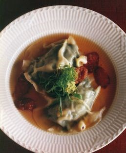 Lamb's brains-and-spinach dumplings with crispy pork sausage, green onions and green garlic ginger relish