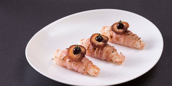 Langoustines wrapped in pancetta with date purée - 'shrimp in mink'