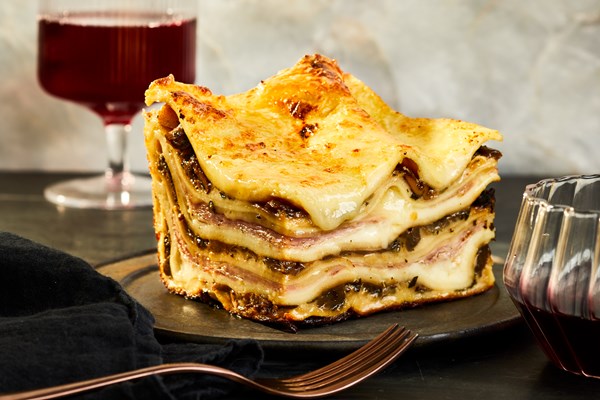 Lasagna with mushroom ragù and prosciutto cotto