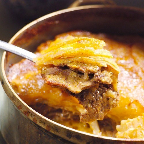 Layered beef and root vegetables in a spicy coconut curry