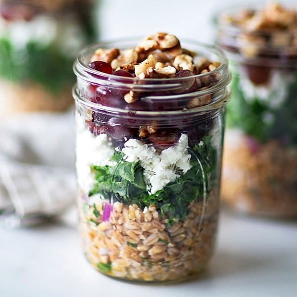 Layered farro salad with kale, feta, and grapes