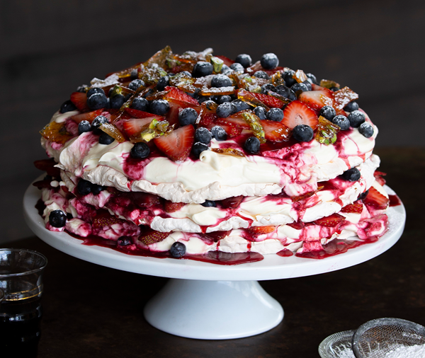 Layered meringue torte with berries & pralines