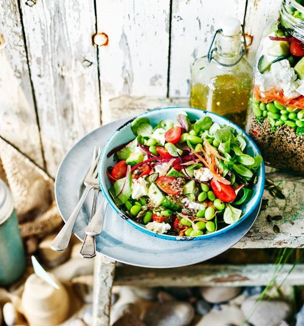 Layered rainbow salad with quinoa and feta