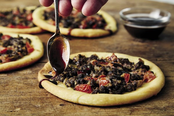Lebanese flatbreads with spiced beef, tomatoes, and tahini