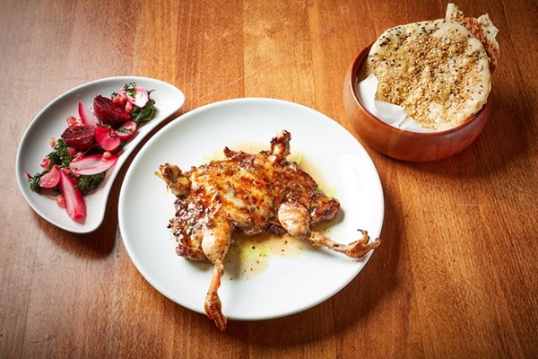 Lebanese-spiced spatchcocked partridge with pickles and flatbreads