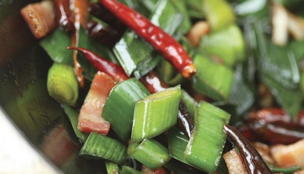 Leek greens stir-fry with salty pork belly 