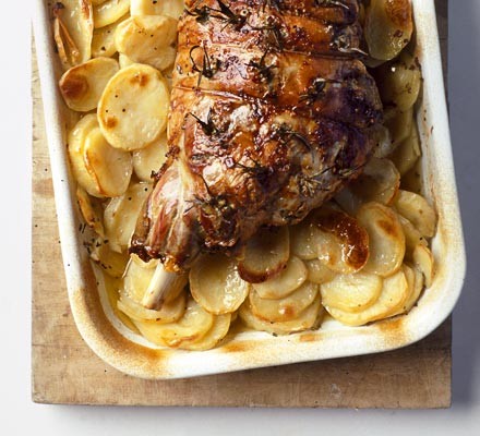 Leg of lamb cooked with potatoes