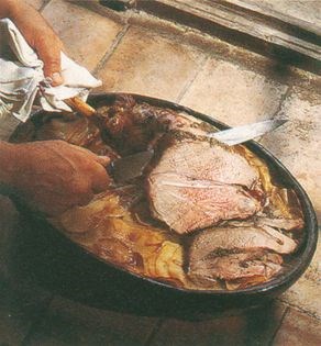 Leg of lamb on a bed of potatoes