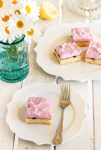 Lemon cake squares with cherry meringue icing