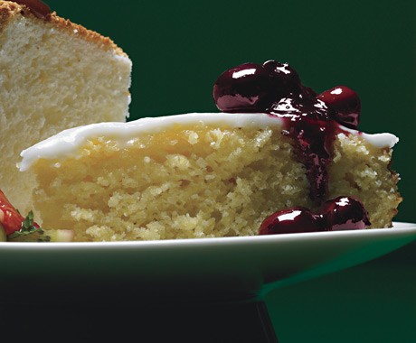 Lemon cornmeal cake with lemon glaze and crushed-blueberry sauce
