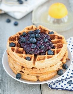 Lemon cornmeal waffles with blueberry sauce