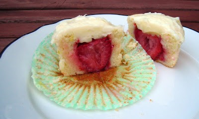 Lemon cupcakes with fresh strawberry centers