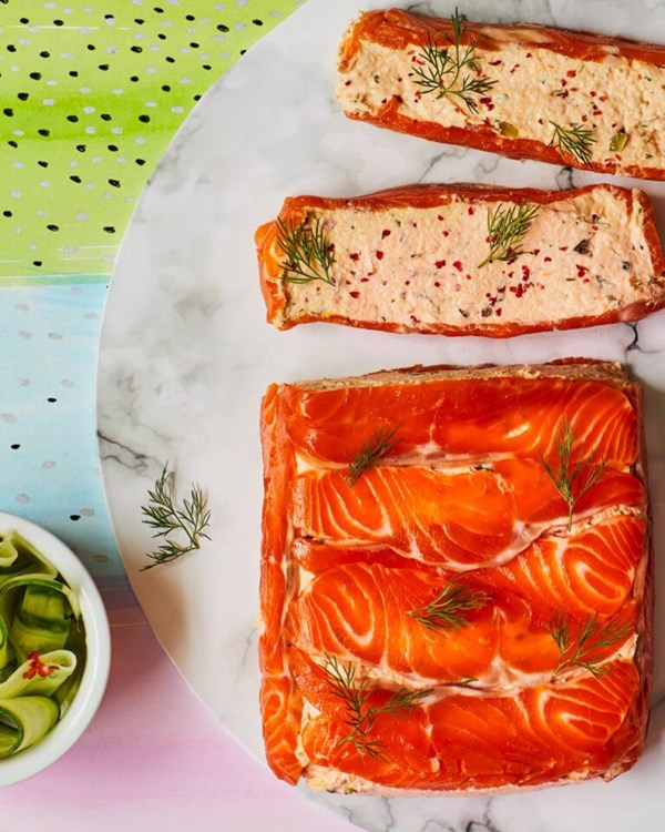 Lemon-cured trout terrine with pink peppercorns and elderflower-pickled cucumber 