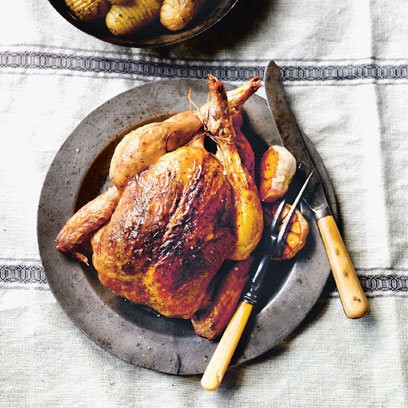 Lemon, garlic, and rosemary roast chicken with Hasselback roast potatoes