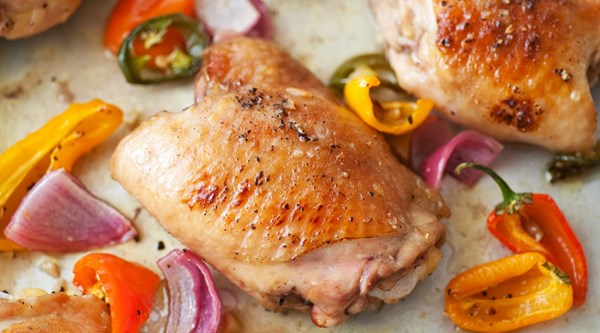 Lemon-honey glazed chicken, peppers and whole garlics