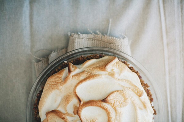 Lemon meringue ice cream pie in toasted pecan crust