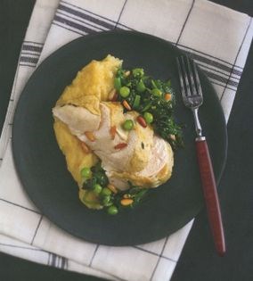 Lemon-poached chicken on Manchego polenta with Sichuan pepper, spinach, pine nuts, peas and beans
