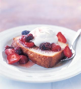 Lemon pound cake with berries and whipped cream