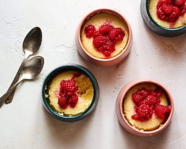 Lemon pudding cakes with sugared raspberries