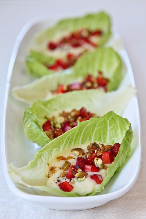Lemon pudding on romaine leaf lettuce with fresh strawberries, candied pistachios and Cypress black sea salt (naturally gluten free)