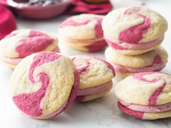 Lemon-raspberry marble sandwich cookies [raspberry jam frosting]