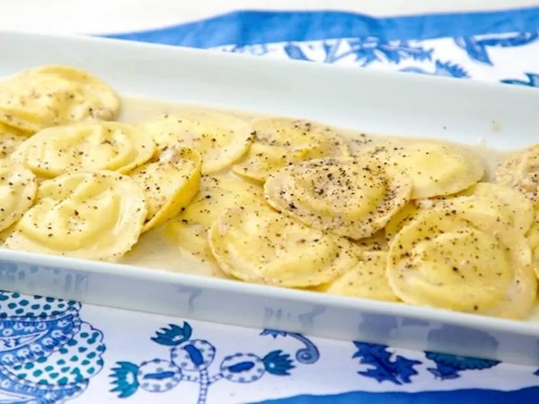 Lemon-ricotta ravioli with cacio e pepe sauce