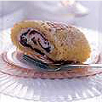 Lemon roulade filled with strawberries and cream