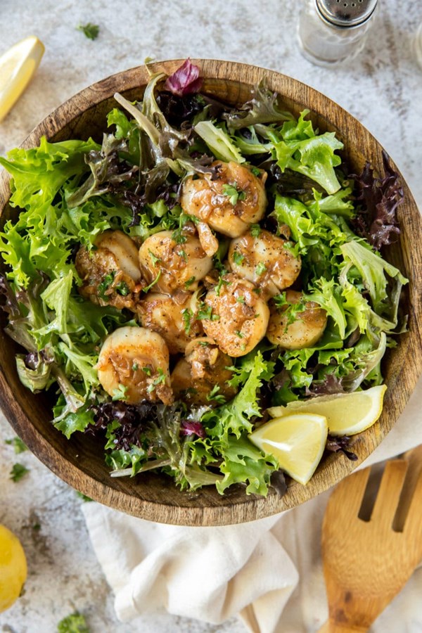 Lemon scallops over greens