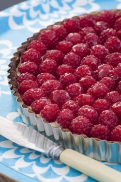 Lemon tart topped with raspberries
