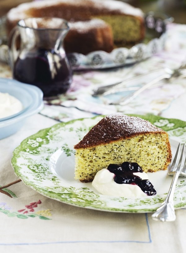 Lemon yoghurt and poppy seed cake with blueberry sauce