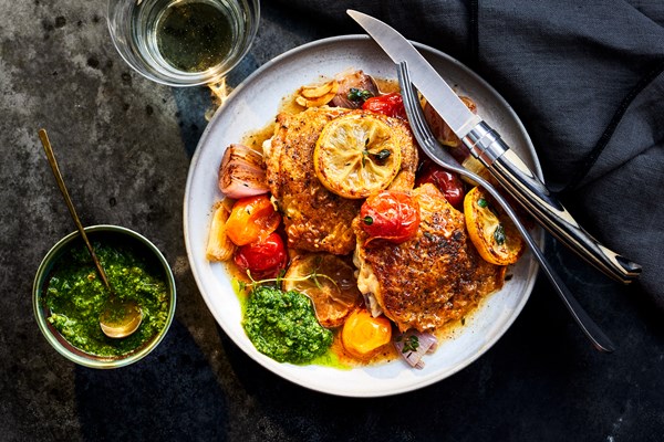 Lemony chicken thighs with burst tomatoes and Swiss chard pesto