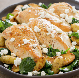 Lemony chicken with wilted spinach and potatoes