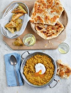 Lentil dhal with poached eggs and roti canai