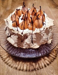 Light brown Pavlova with poached pears & chocolate