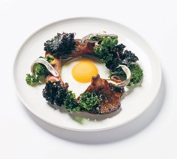 Lightly fried egg w mushrooms, white anchovies + crispy kale