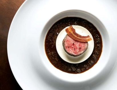 Lightly smoked roasted black Angus beef tenderloin with sunchoke soufflé and Périgourdine sauce